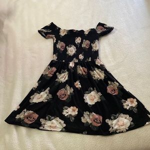 Small girls dress with pastel flowers.